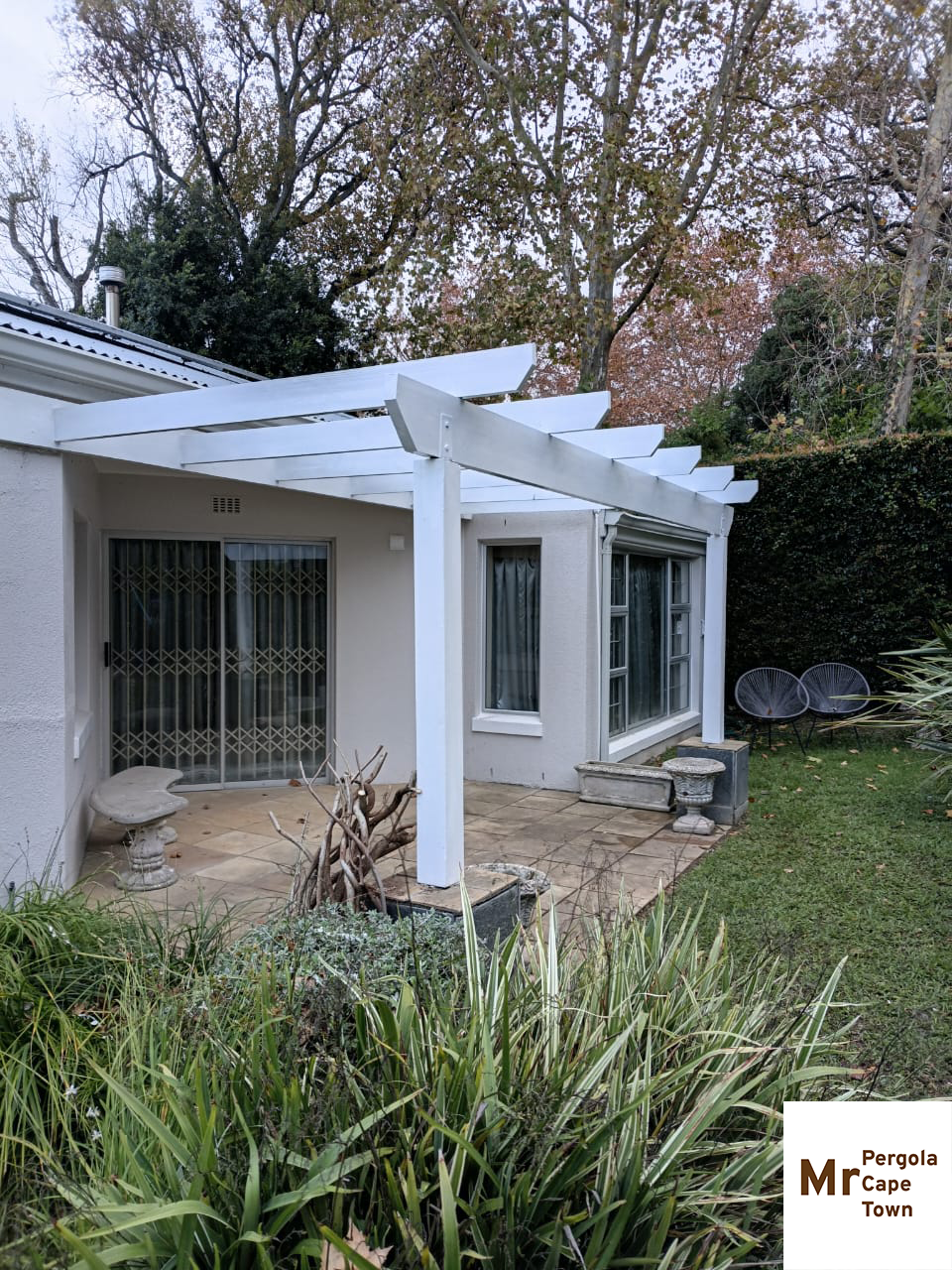 constantia-pergola-repair a repaired storm damaged wooden pergola in constantia
